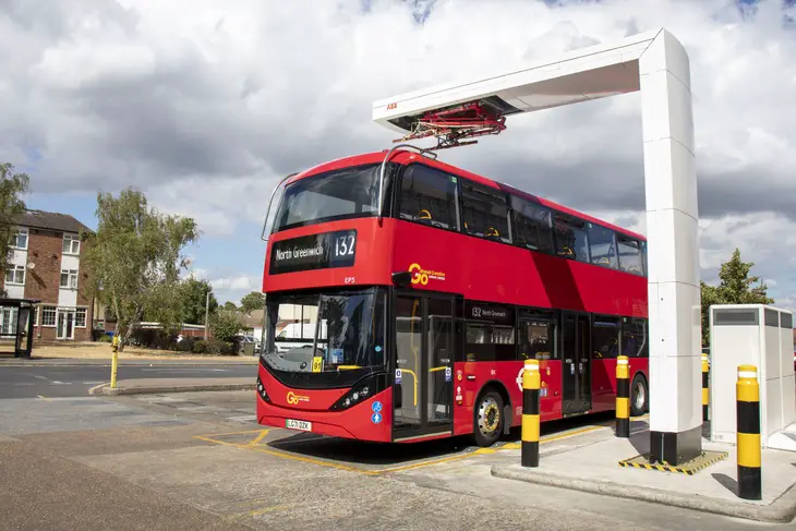 A 132 bus is charged using one of the new pantographs, which will also be used on the new buses on the 358 route. Image: TfL